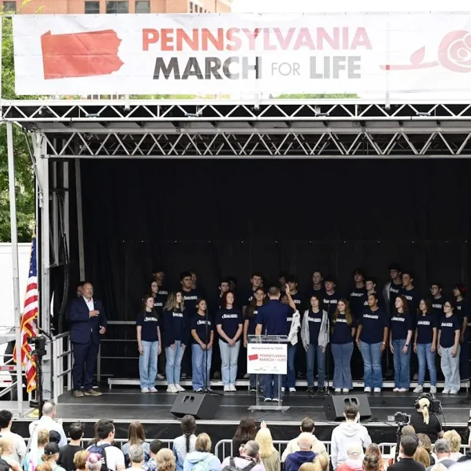 The choir from Bishop McDevitt High School in Harrisburg performs the National Anthem as the rally for the March for Life gets underway.